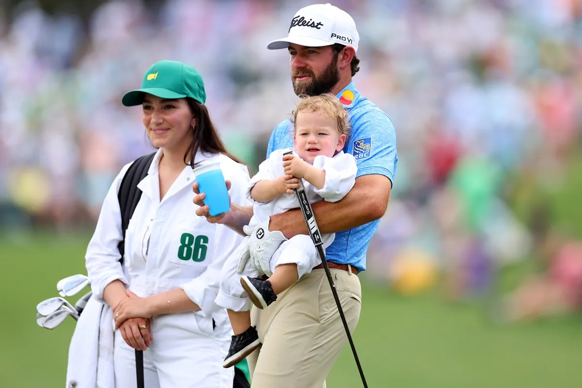 Cameron Young looks on with his wife, Kelsey, and son, Henry, during the 2023 Masters Tournament