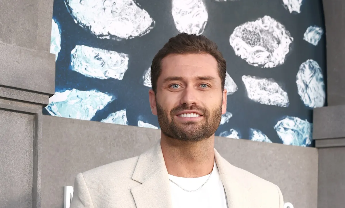 Dakota Mortensen of 'The Secret Lives of Mormon Wives' in a white jacket and shirt