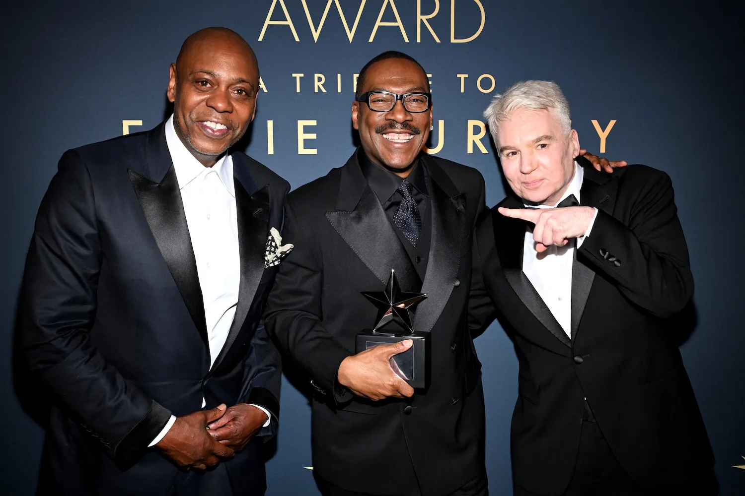 Dave Chappelle, Eddie Murphy, and Mike Myers in tuxedos