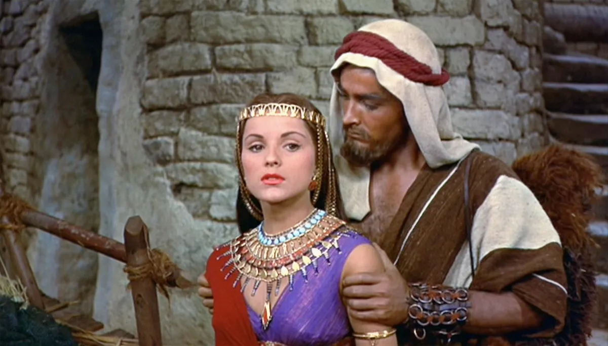 Joshua (John Derek) with his hands on Lilia's (Debra Paget) shoulders in 'The Ten Commandments'