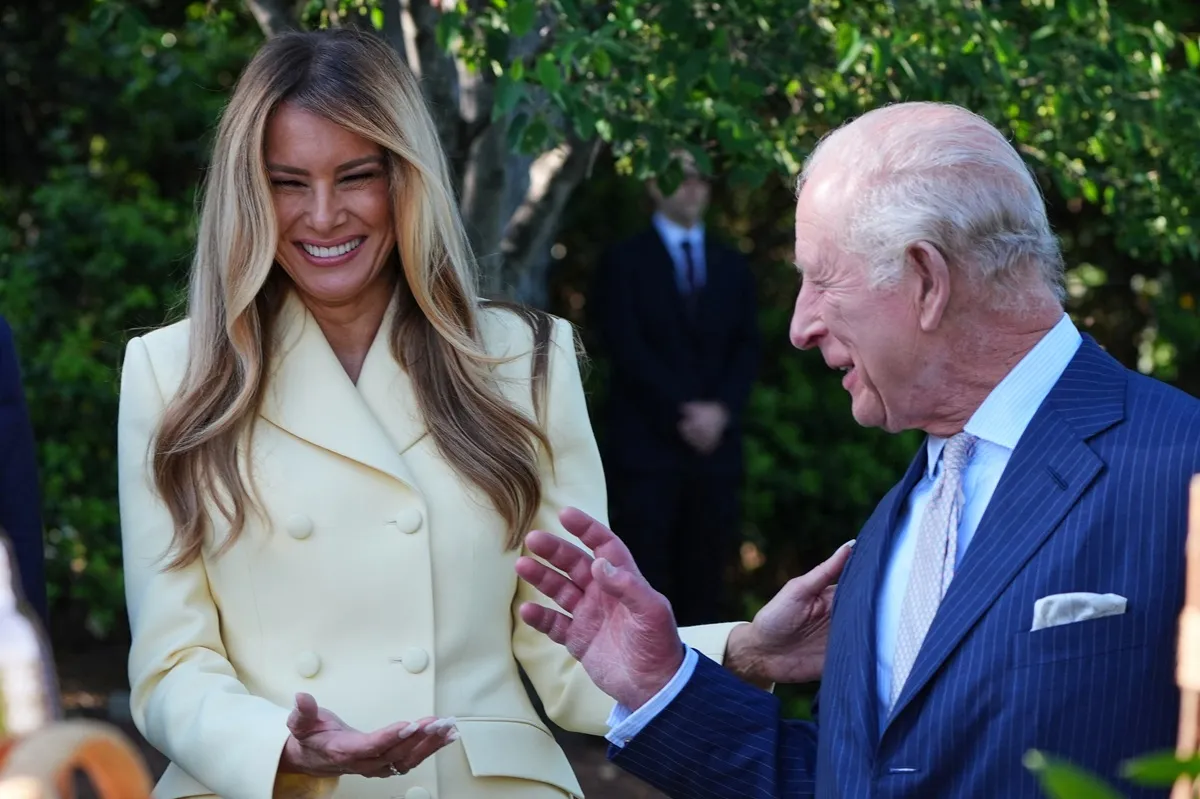 First Lady Melania Trump laughs with King Charles III as they tour the White House Beehive