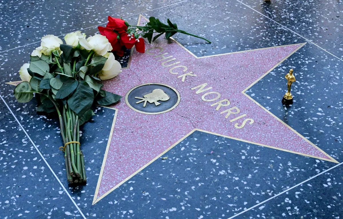 Flowers are left on the Hollywood Walk of Fame star of Chuck Norris following his death