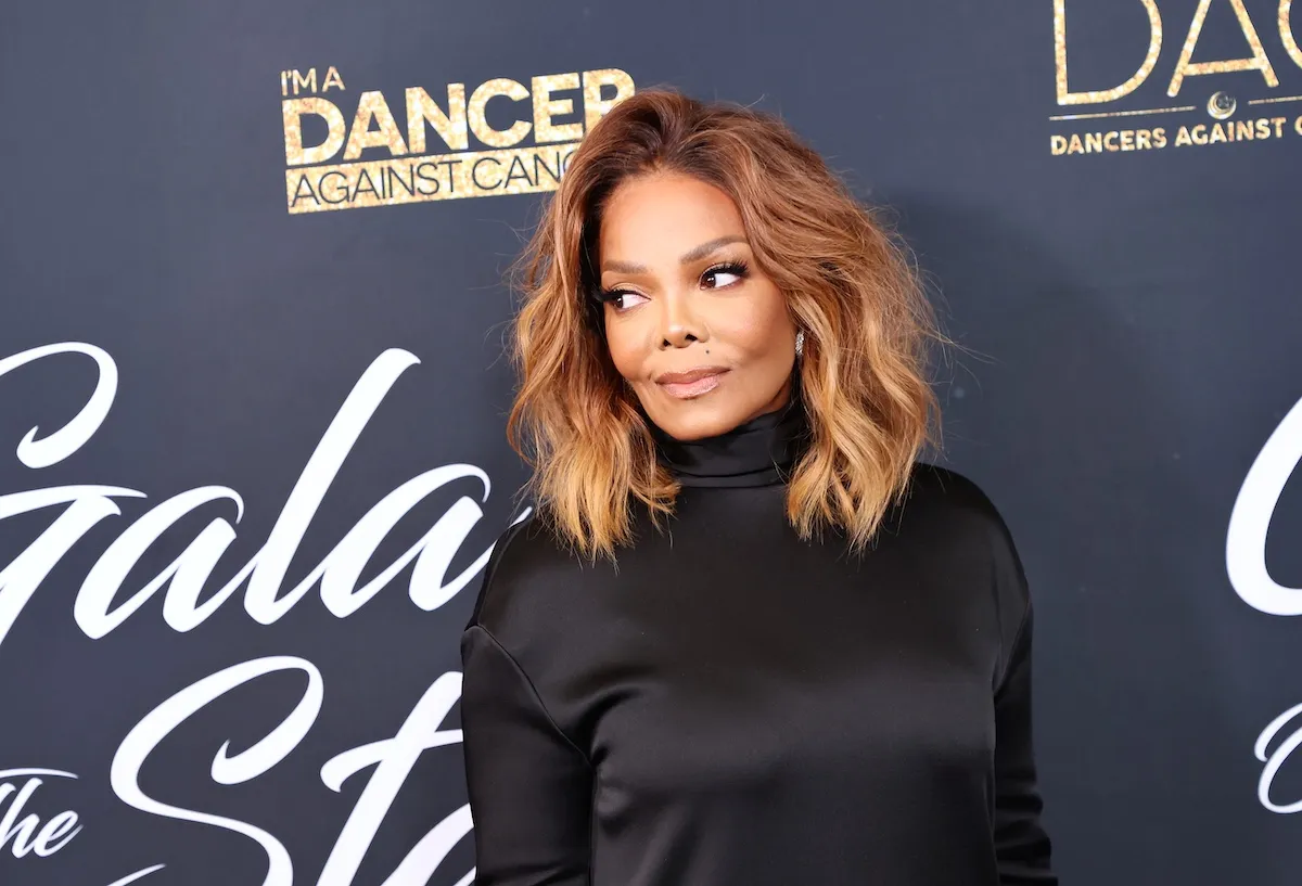 Janet Jackson wearing a black turtleneck