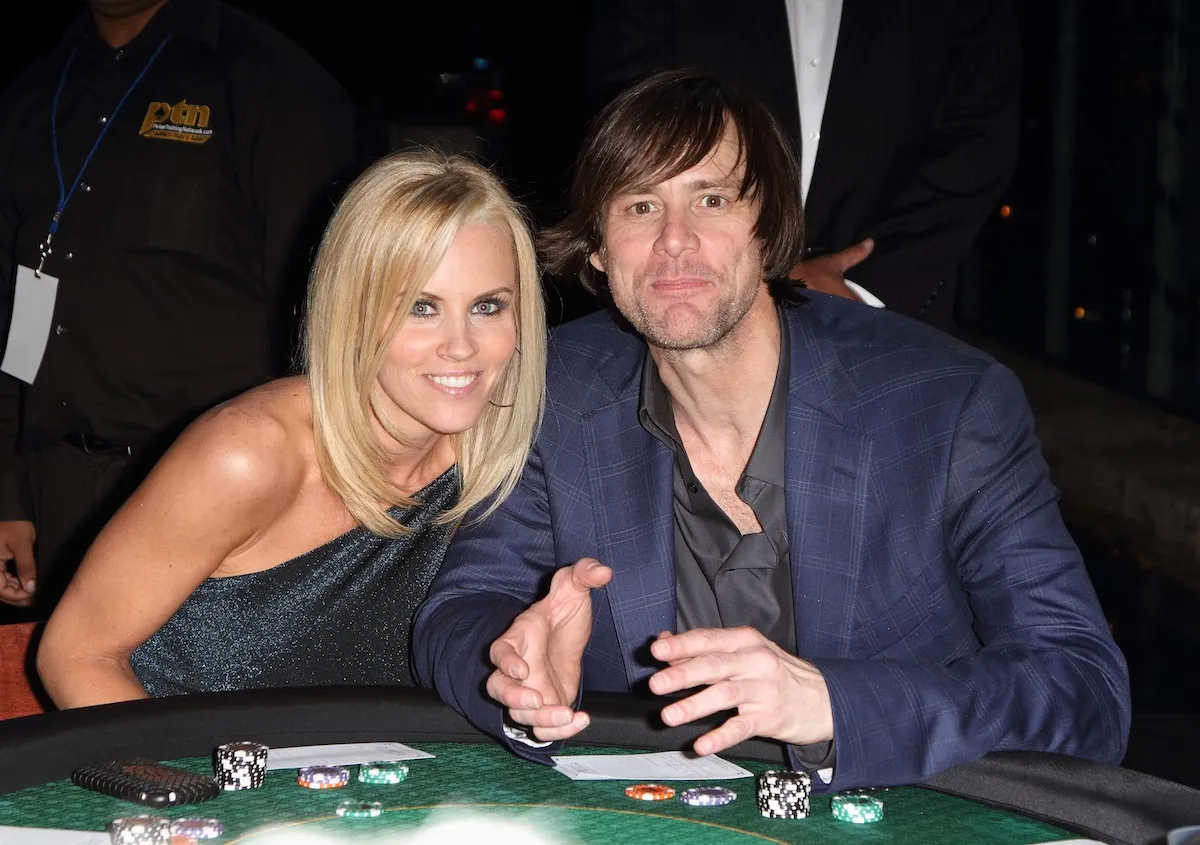 Jim Carrey and Jenny McCarthy sitting next to each other in 2010