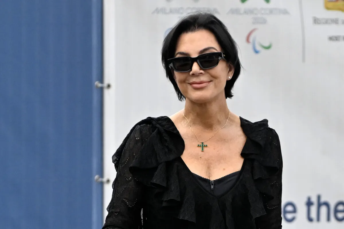 Kris Jenner wears black with sunglasses.