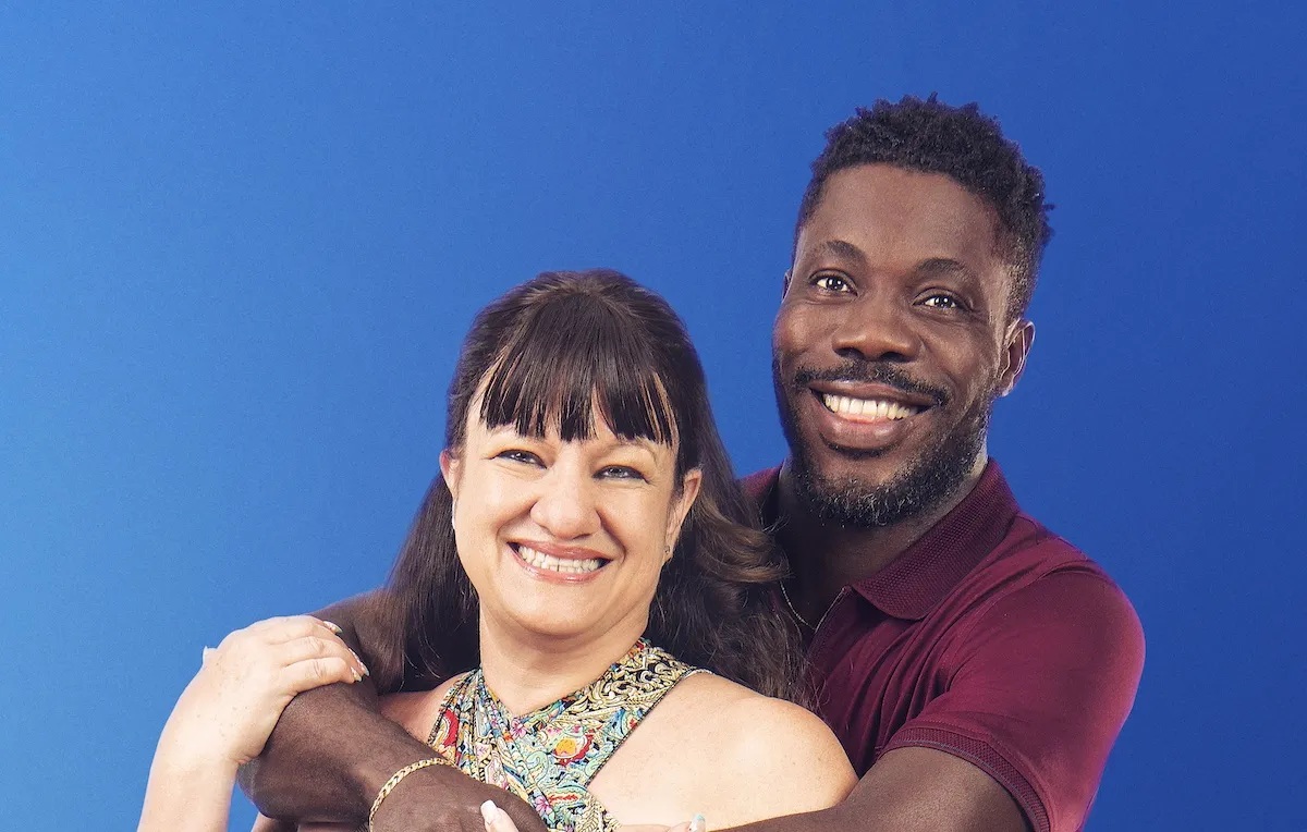 '90 Day Fiance: Before the 90 Days' cast member Daniel with his arms around Lisa against a blue background