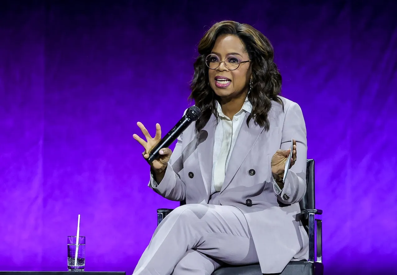 Oprah Winfrey in a lavender suit at CinemaCon in 2023