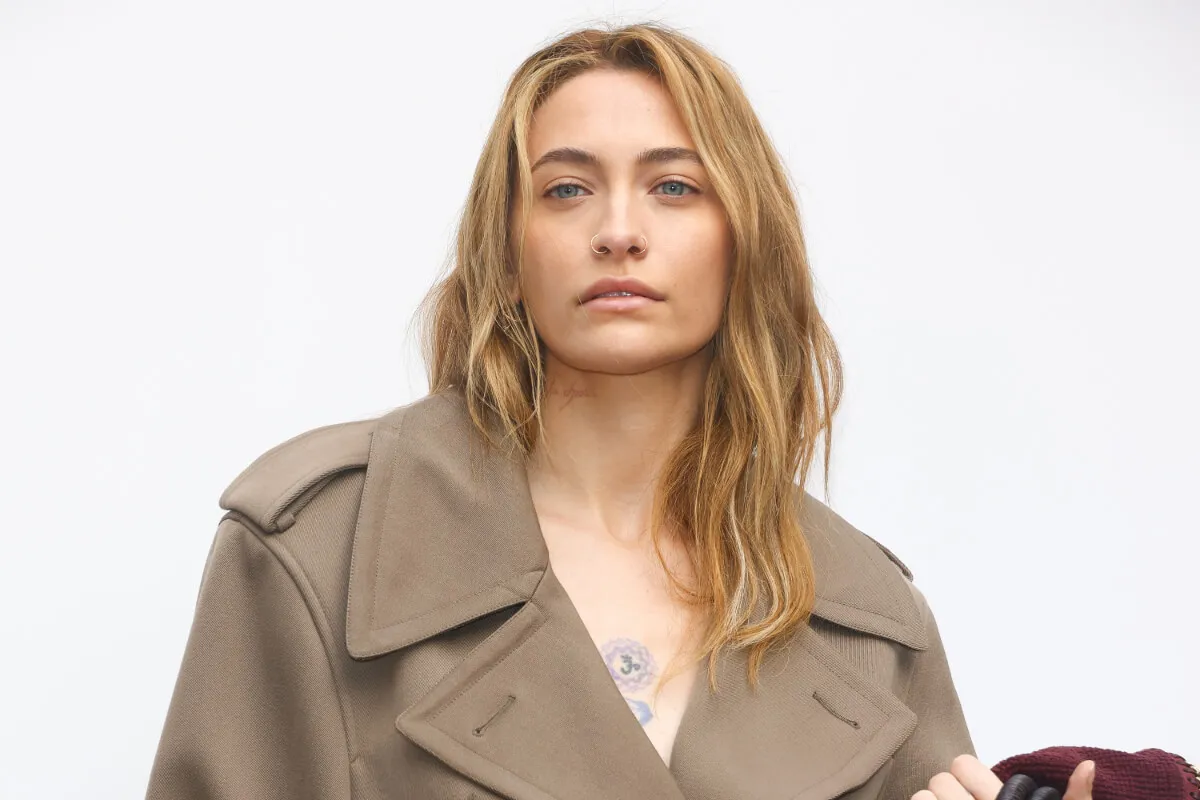 Paris Jackson wears a trench coat.