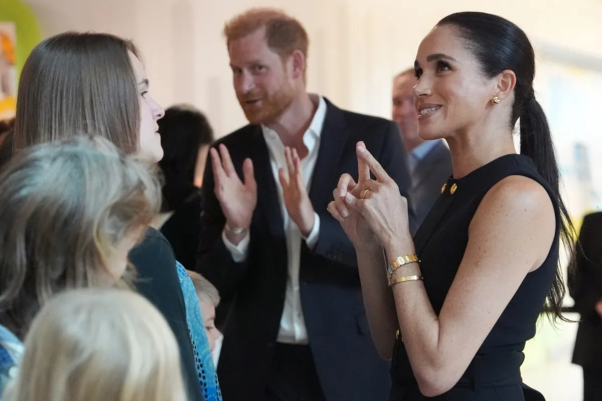 Prince Harry and his wife, Meghan Markle, meet people at the Royal Children's Hospital in Melbourne, Australia
