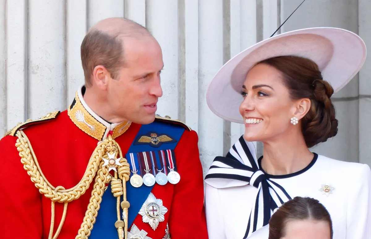 Prince William and Kate Middleton watch an RAF flypast from the balcony of Buckingham Palace after attending Trooping the Colour
