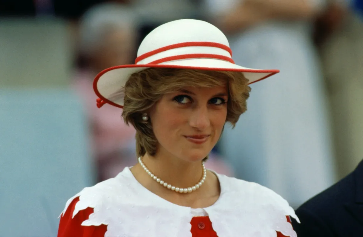 Princess Diana in a red and white hat