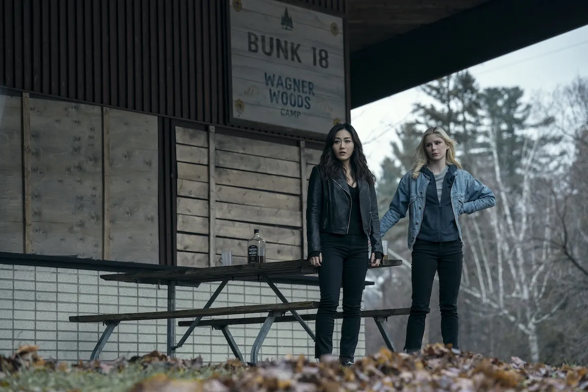 Karen Fukuhara (Kimiko), Erin Moriarty (Annie January aka Starlight) standing by a picnic table in 'The Boys' Season 5