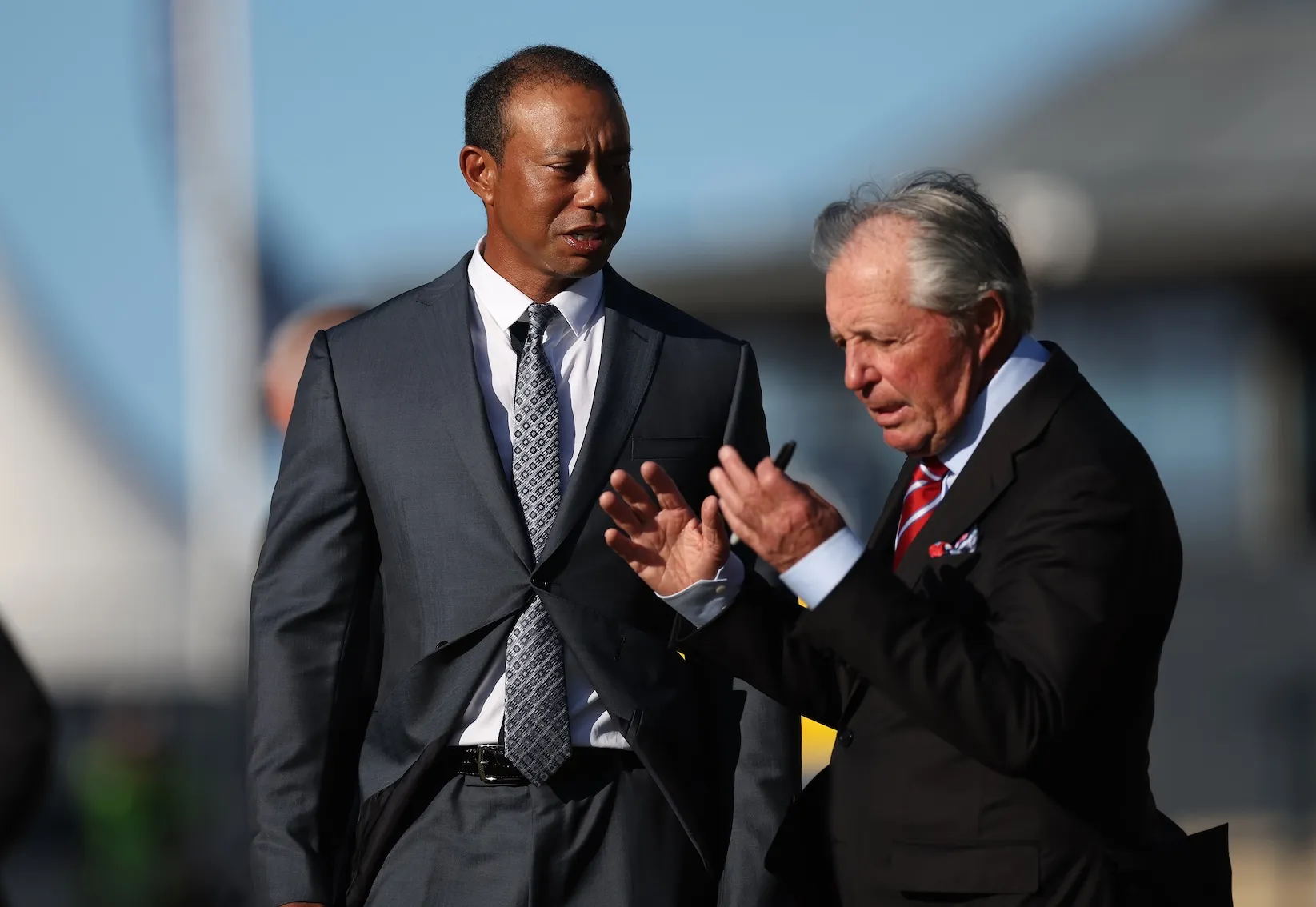 Tiger Woods and Gary Player speaking to each other in 2022