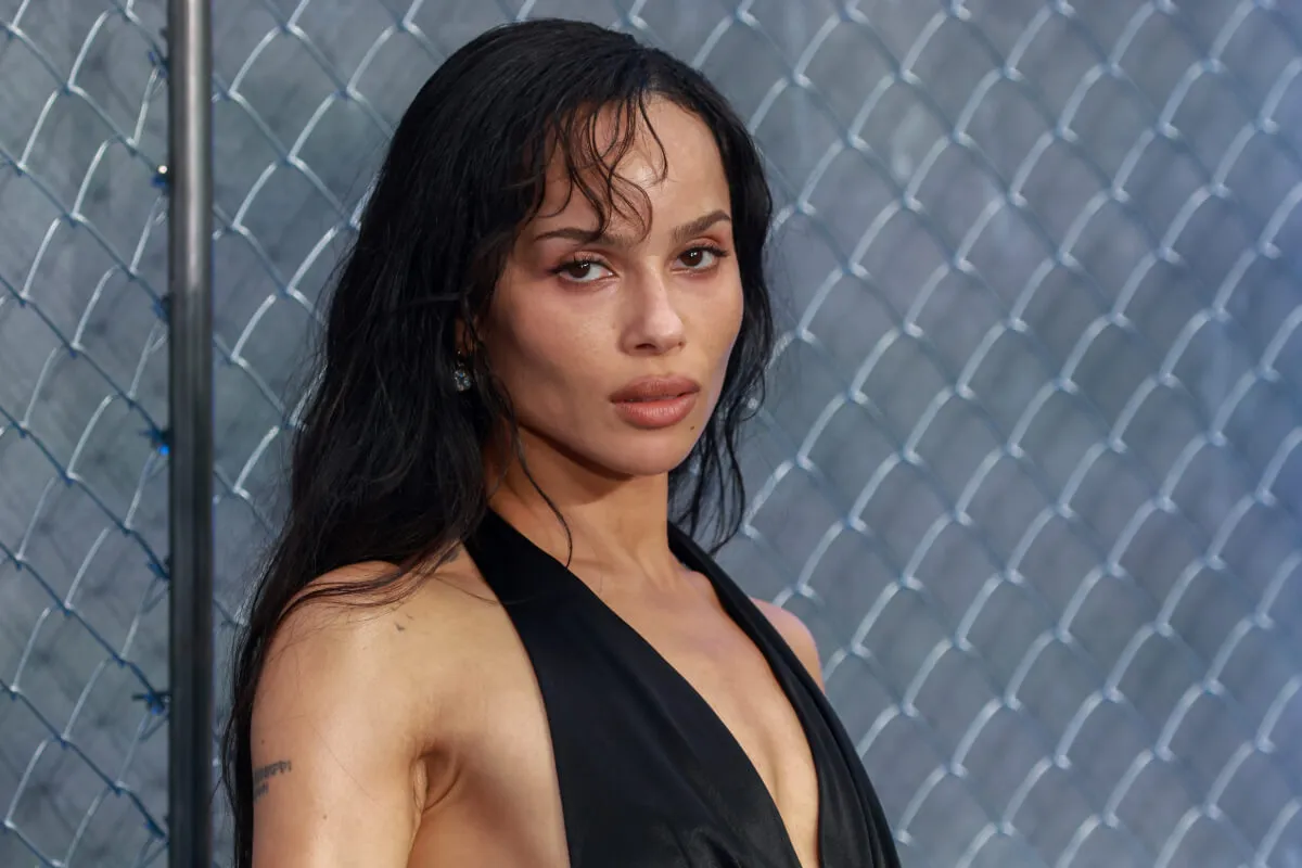 Zoe Kravitz wears a black dress.
