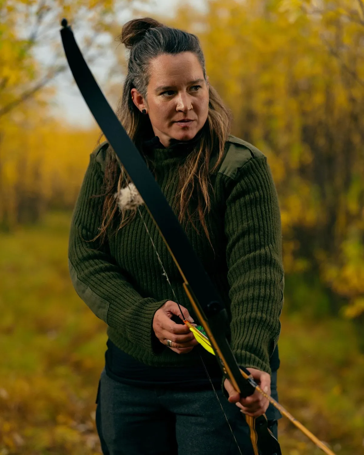 Jacks Genega of 'Alone' Season 13 holding a bow and arrow