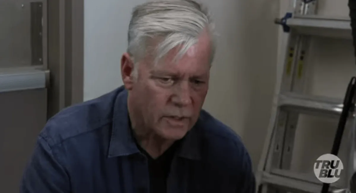 Chris Hansen wearing a blue button-down shirt in an episode of 'Takedown'