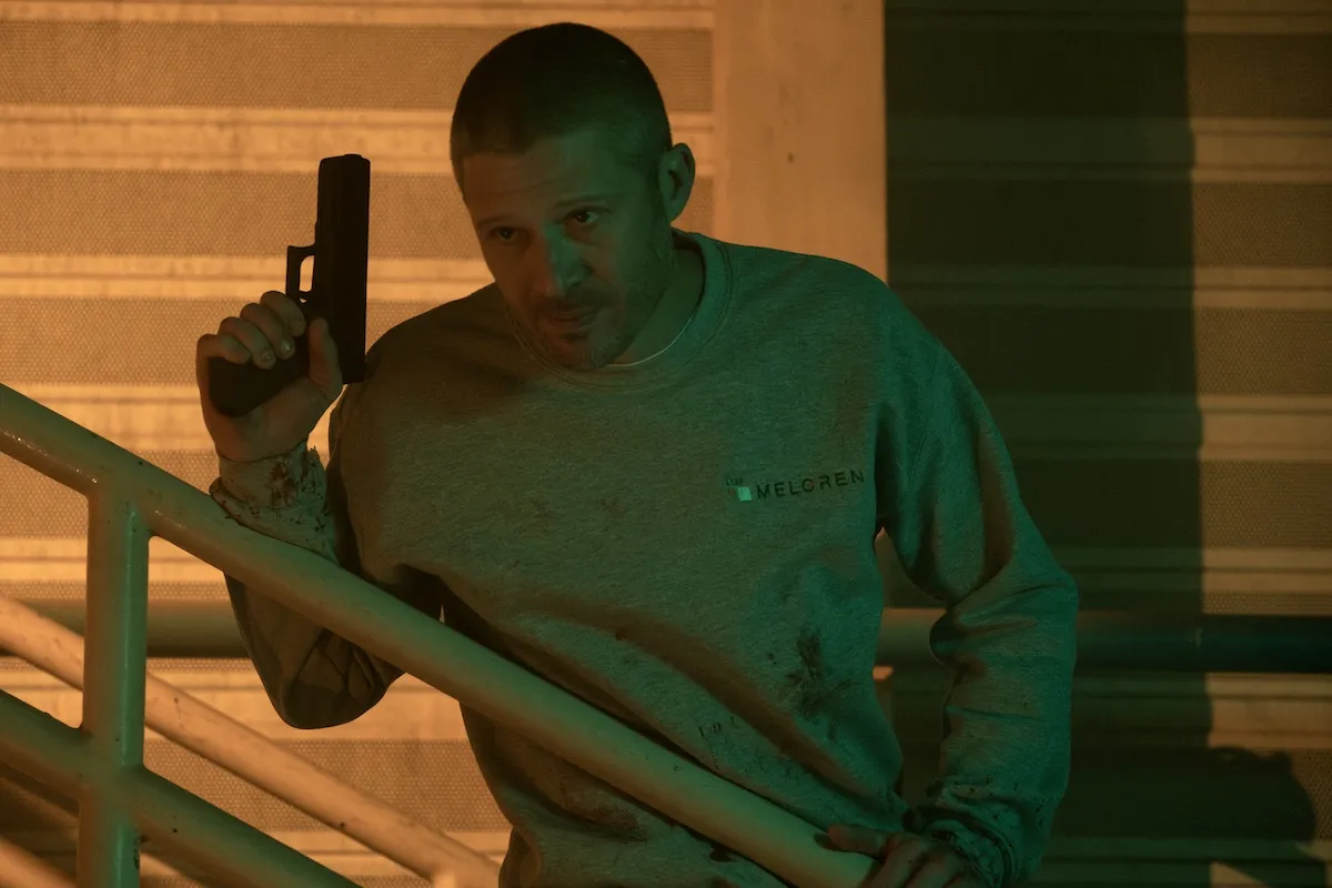 Zach Gilford as Elias Voit holding a gun in 'Criminal Minds'