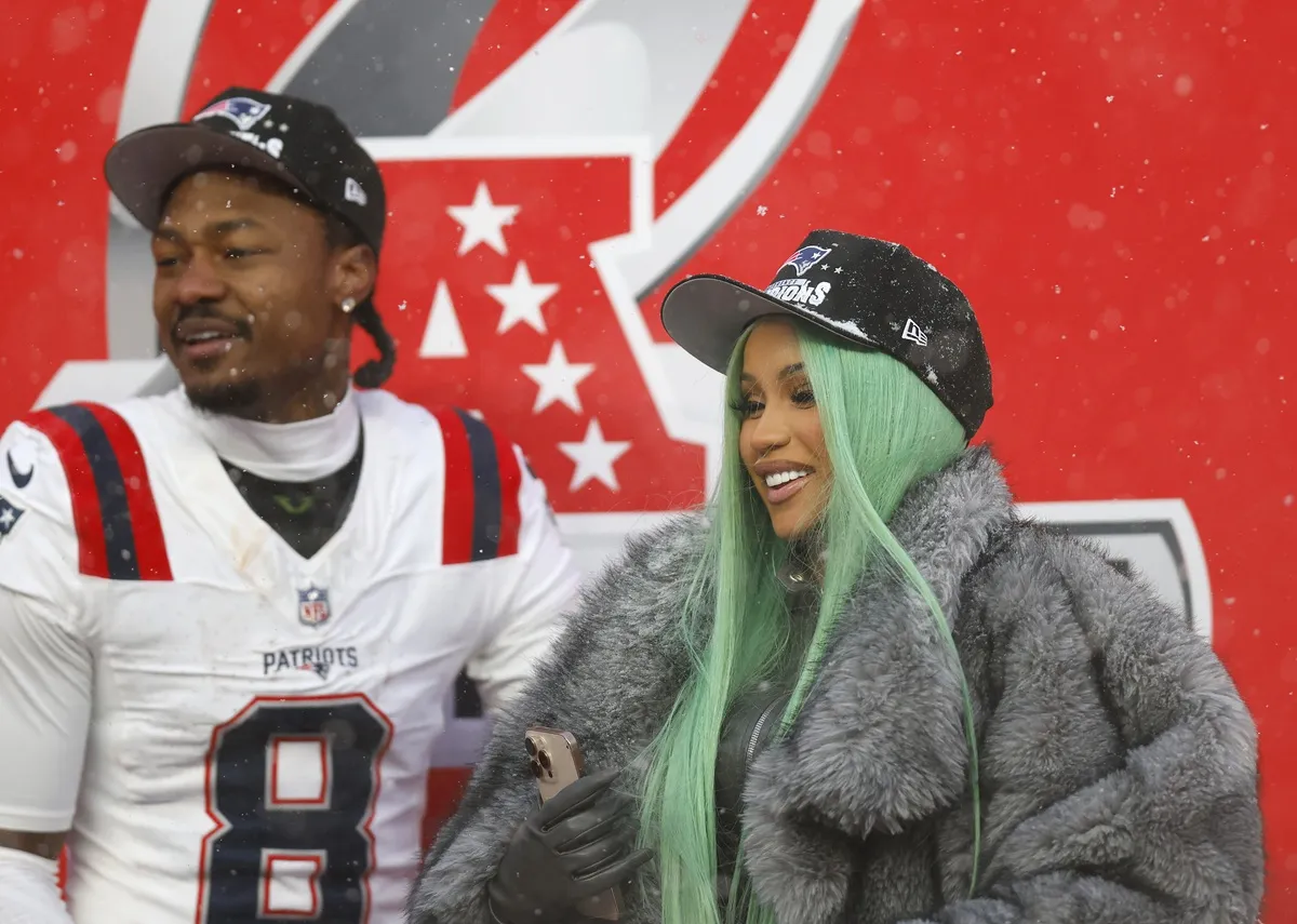 Cardi B and Stefon Diggs #8 of the New England Patriots celebrate following the AFC Championship Playoff game against the Denver Broncos at Empower Field At Mile High on January 25, 2026 in Denver, Colorado