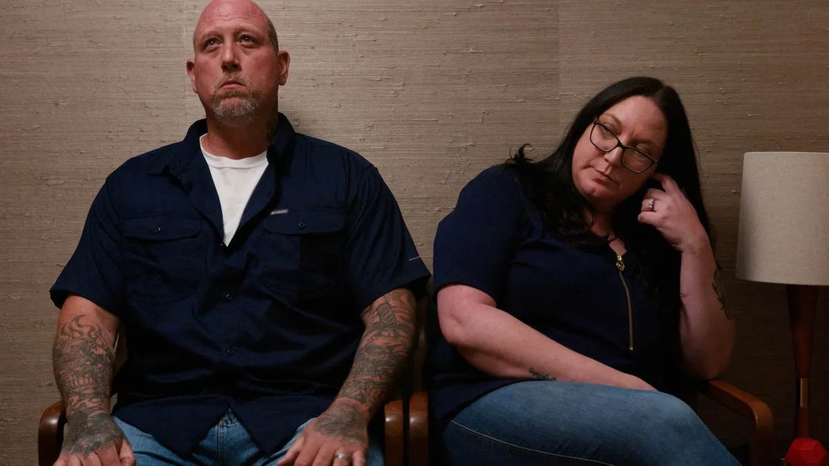 Jason and Marjorie sitting next to each other in 'Couples Therapy'