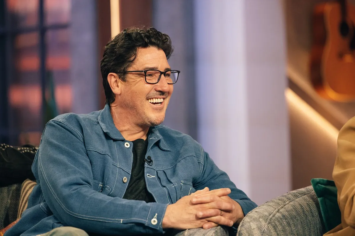 Smiling Jonathan Knight wearing glasses