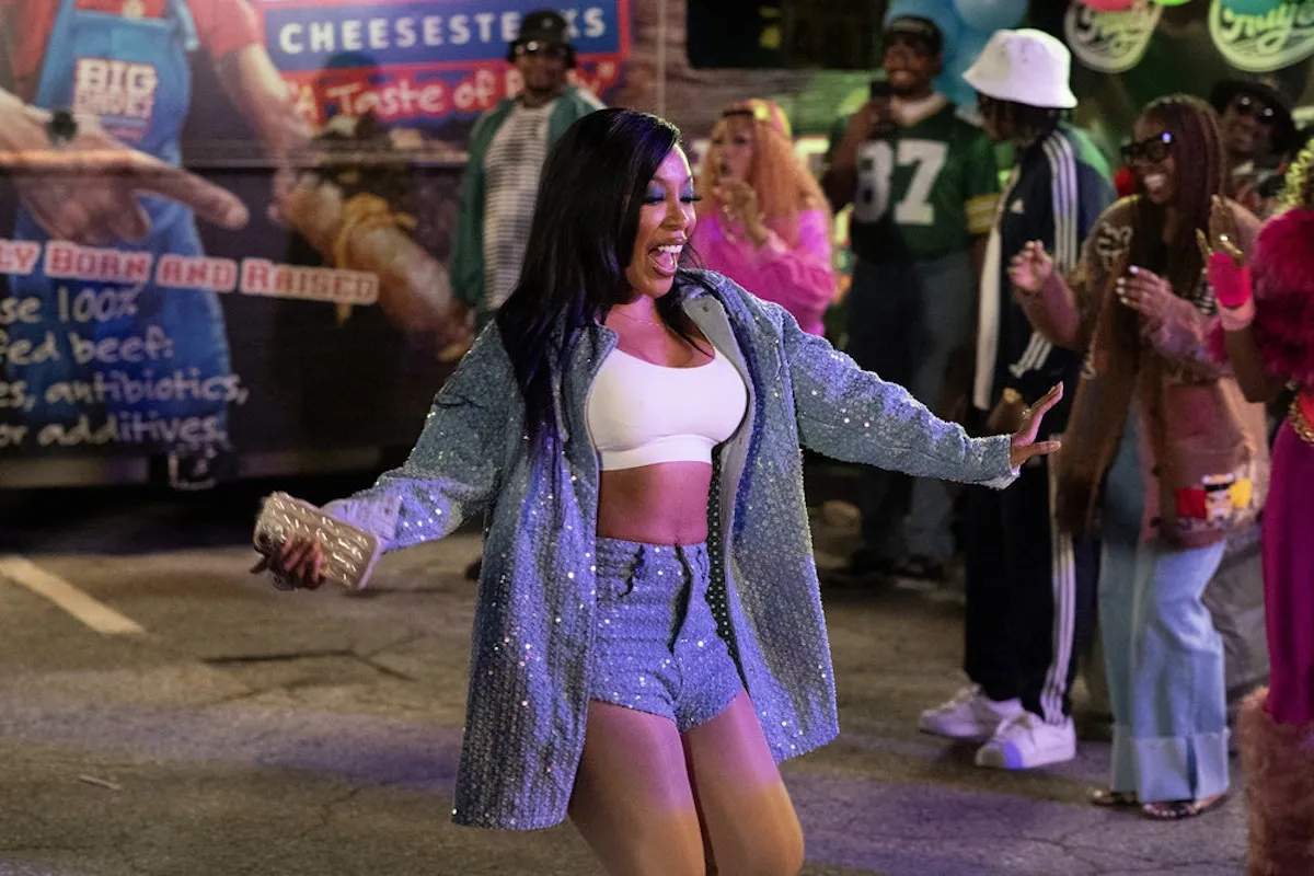 K Michelle wearing shorts and a white crop top in 'RHOA'