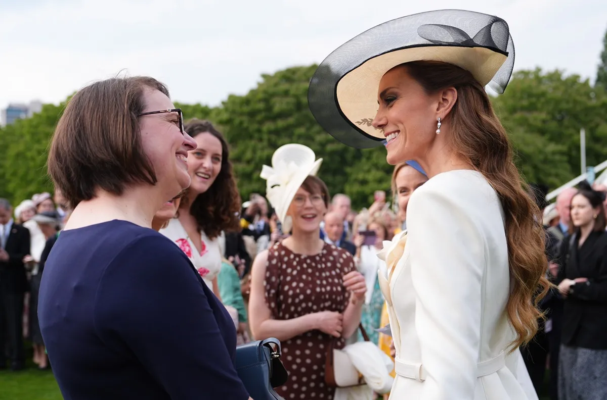 Kate Middleton meets guests during a Royal Garden Party at Buckingham Palace