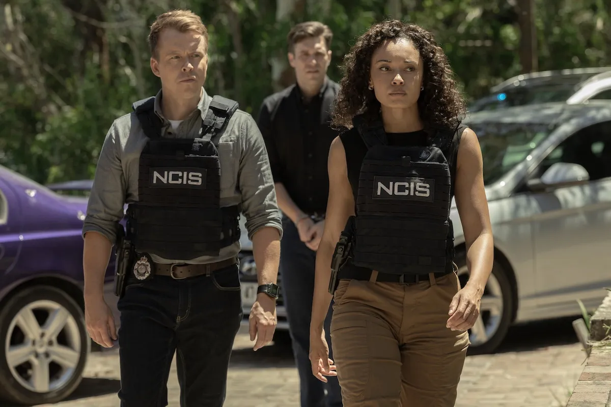 JD, Julian, and Mackey walking while wearing bulletproof vest in 'NCIS: Sydney'