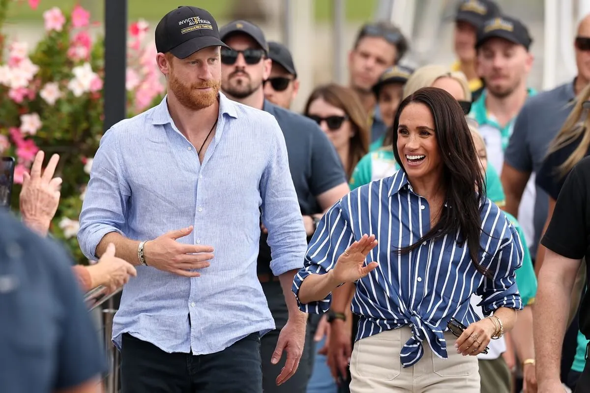 Prince Harry and Meghan Markle greet members of the public at the Cruising Yacht Club of Australia