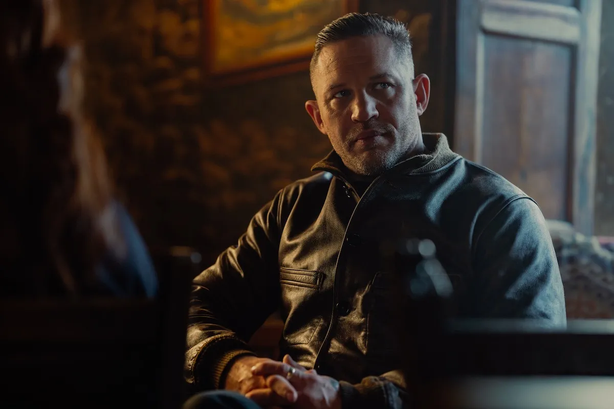 Tom Hardy sitting in a chair in 'MobLand'