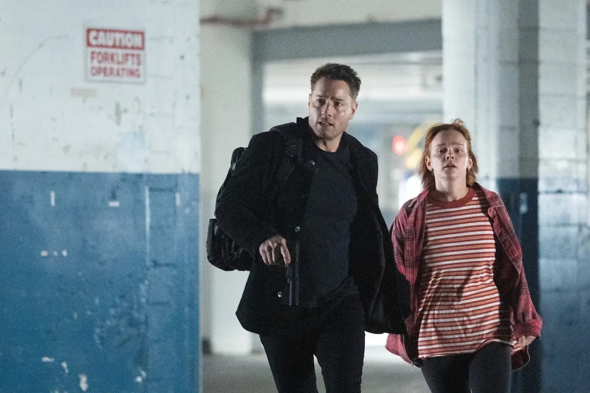 Justin Hartley running next to a woman in a striped top in the 'Tracker' Season 3 finale