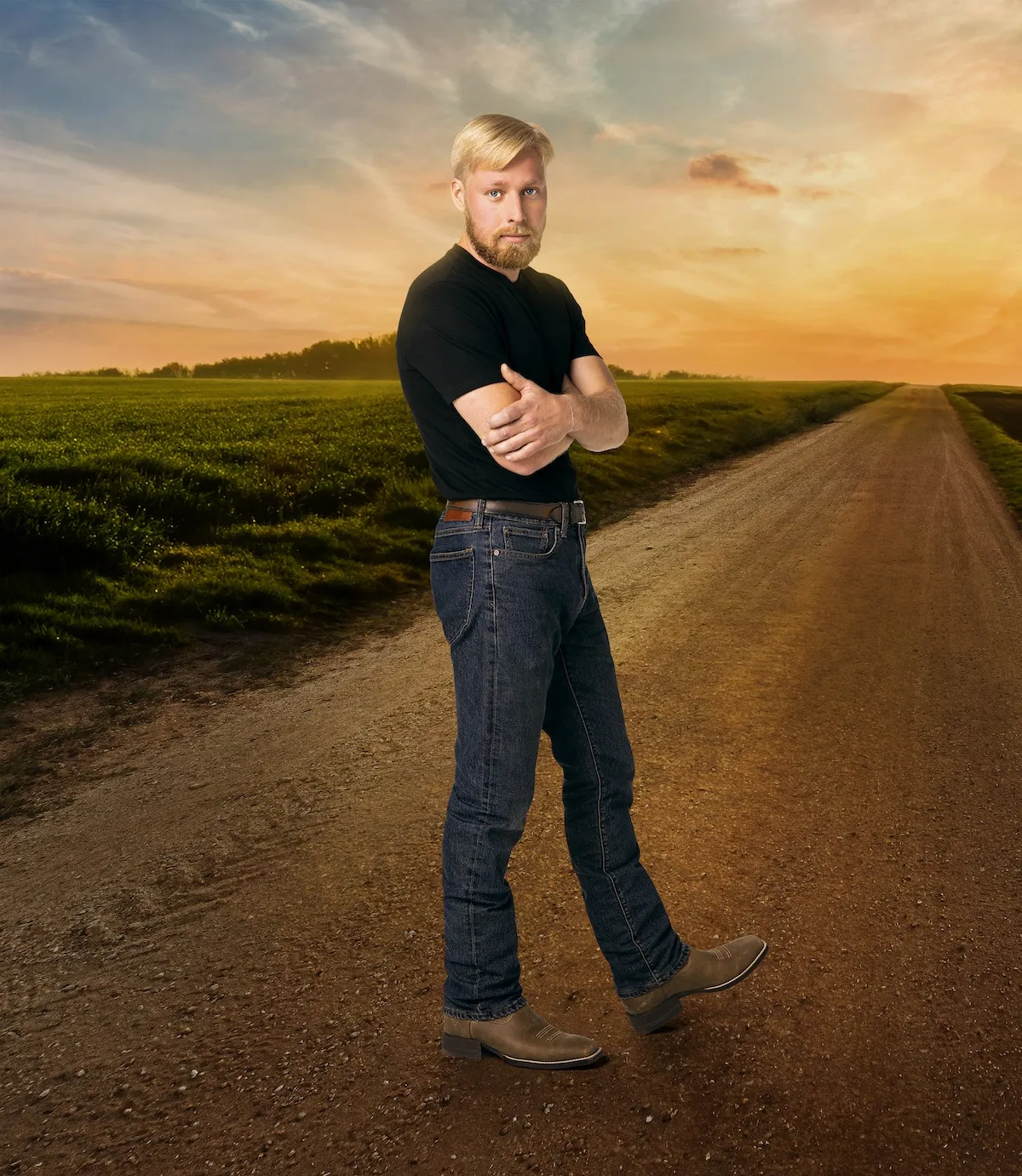 Ethan Plath of Welcome to Plathville standing on a dirt road