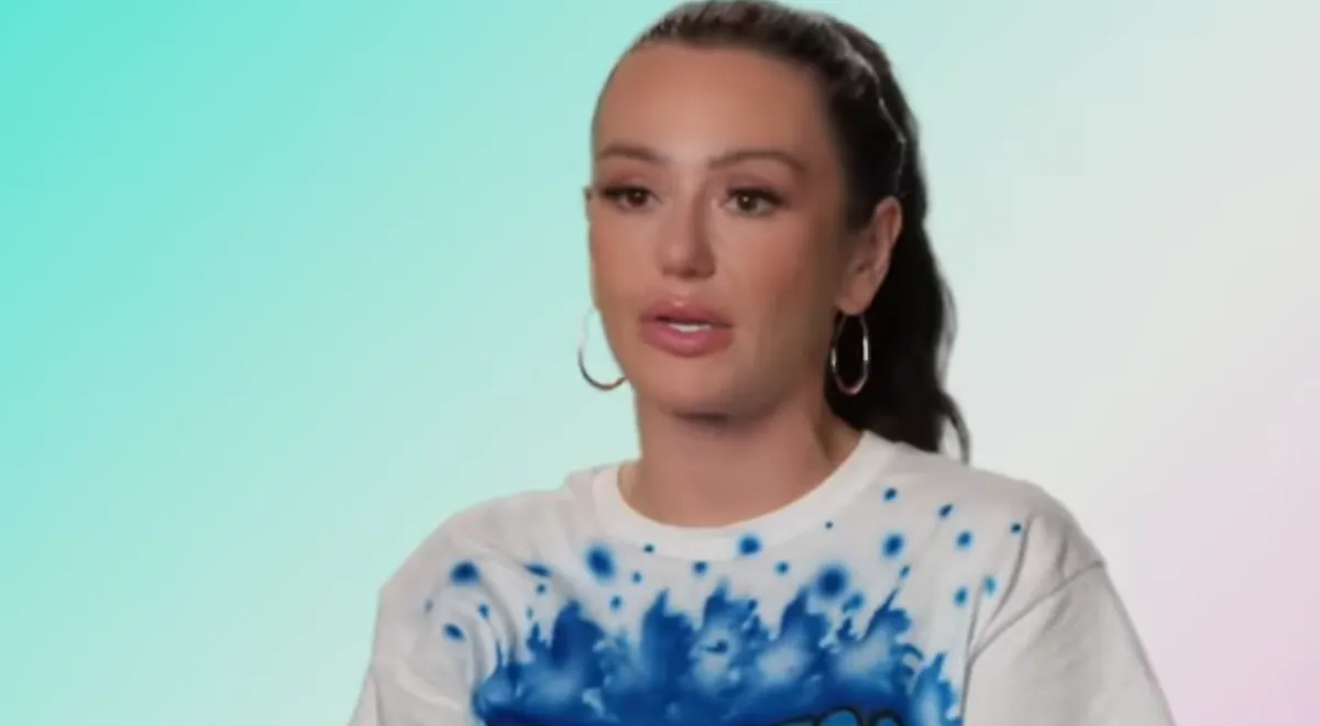 Jenni 'Jwoww' Farley wearing a white and blue t-shirt in an interview segment of 'Jersey Shore Family Vacation