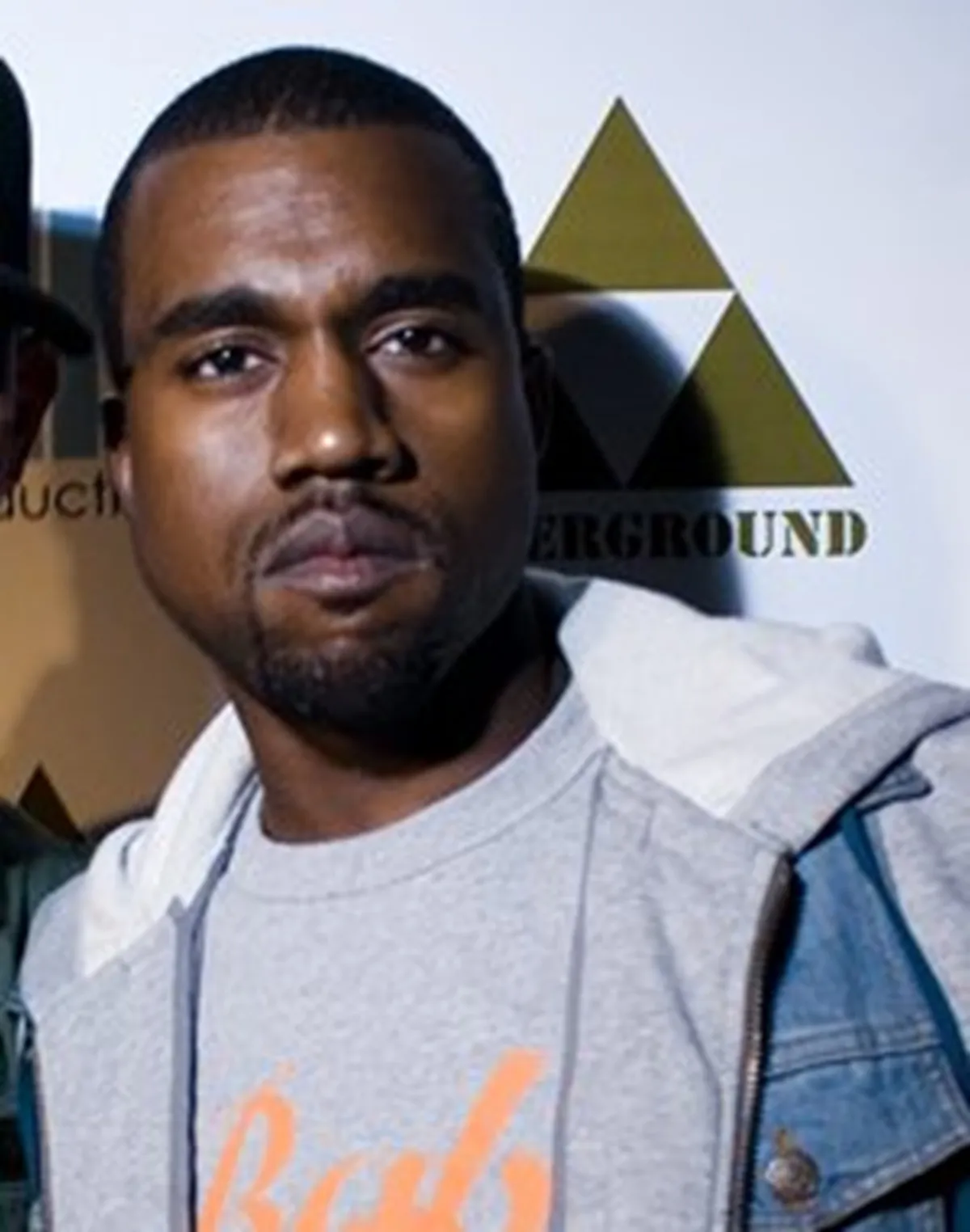 Kanye West seen, early in his career,not smiling.
