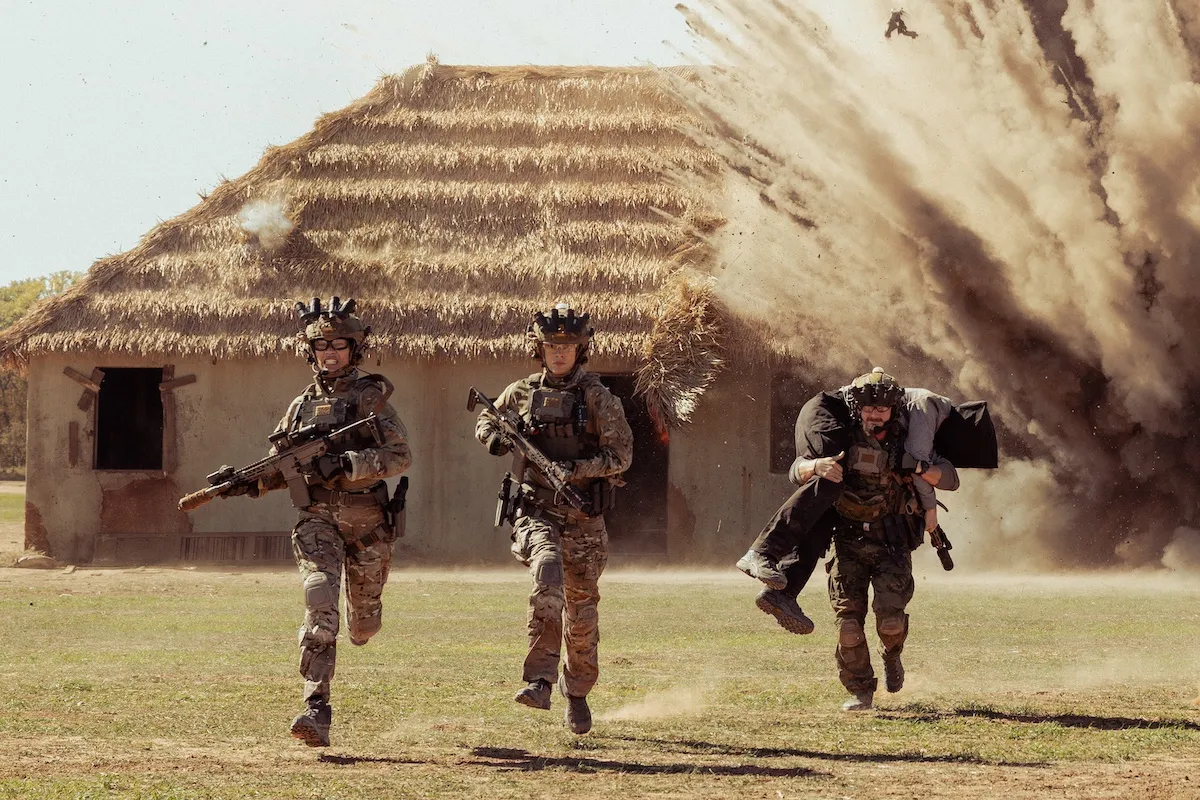 Three soldiers running from an explosion in 'Lioness' Season 3