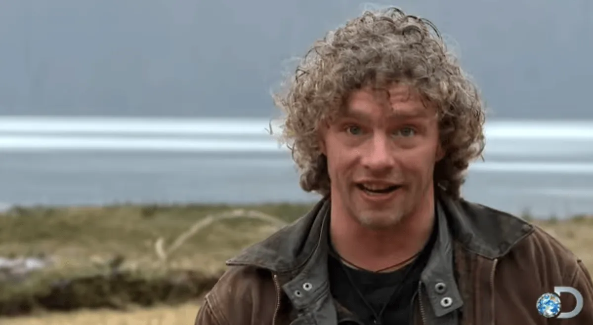 Matt Brown of 'Alaskan Bush People' standing in front of an ocean