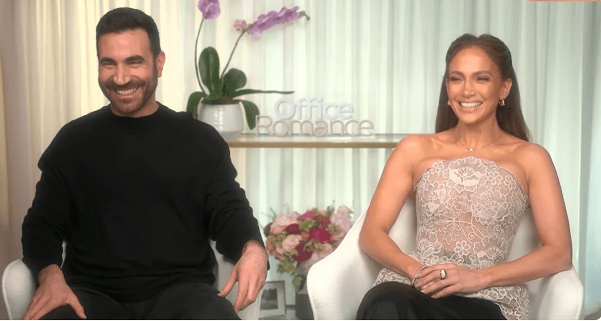 Screenshot of Jennifer Lopez and Brett Goldstein's during 'Extra' interview