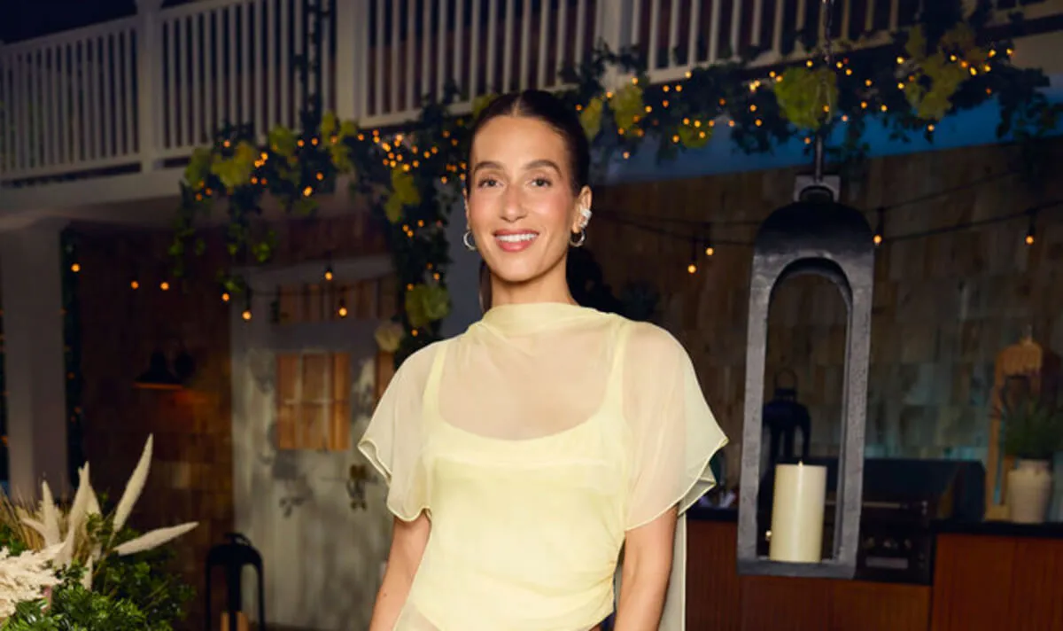 Amanda Batula wears a yellow dress.