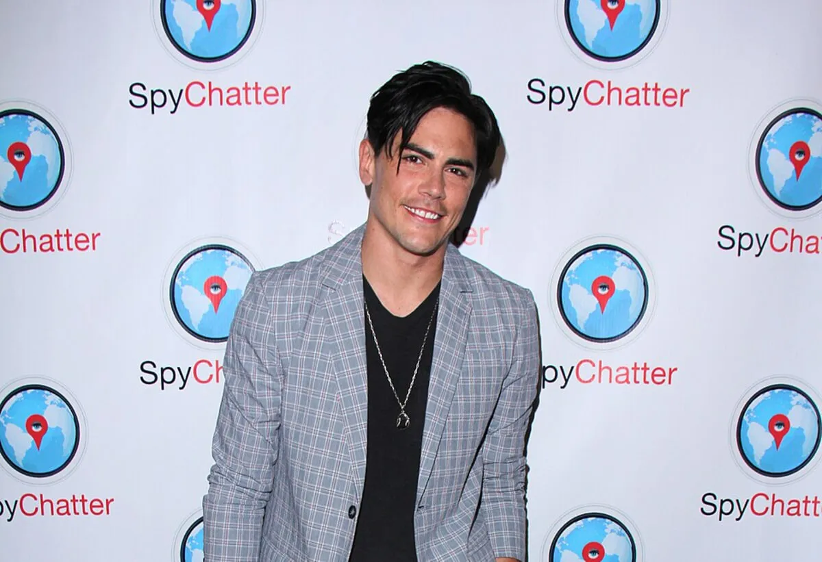 Tom Sandoval wears a gray blazer and a black shirt.