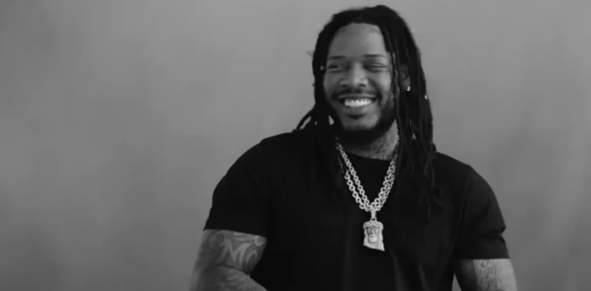 Black and white image of Fetty Wap with a chain around his neck