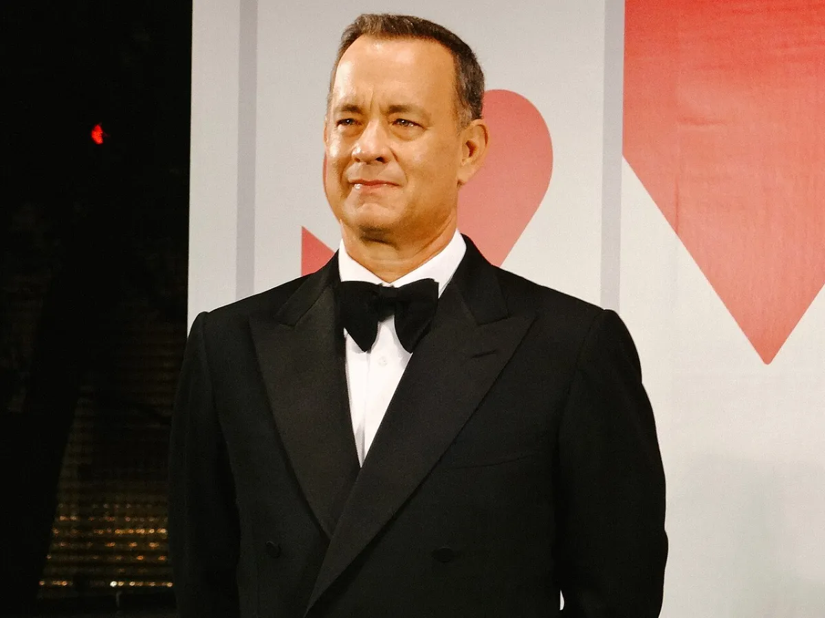 Tom Hanks wears a tuxedo.