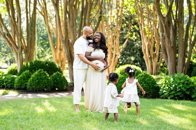 'Married at First Sight' alums Vincent, cradling Briana's belly and their two young children, all dressed in white