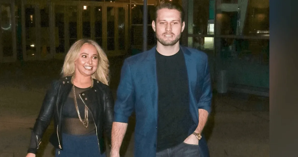 Hayden Panettiere and her ex, Brian Hickerson, hold hands while walking.