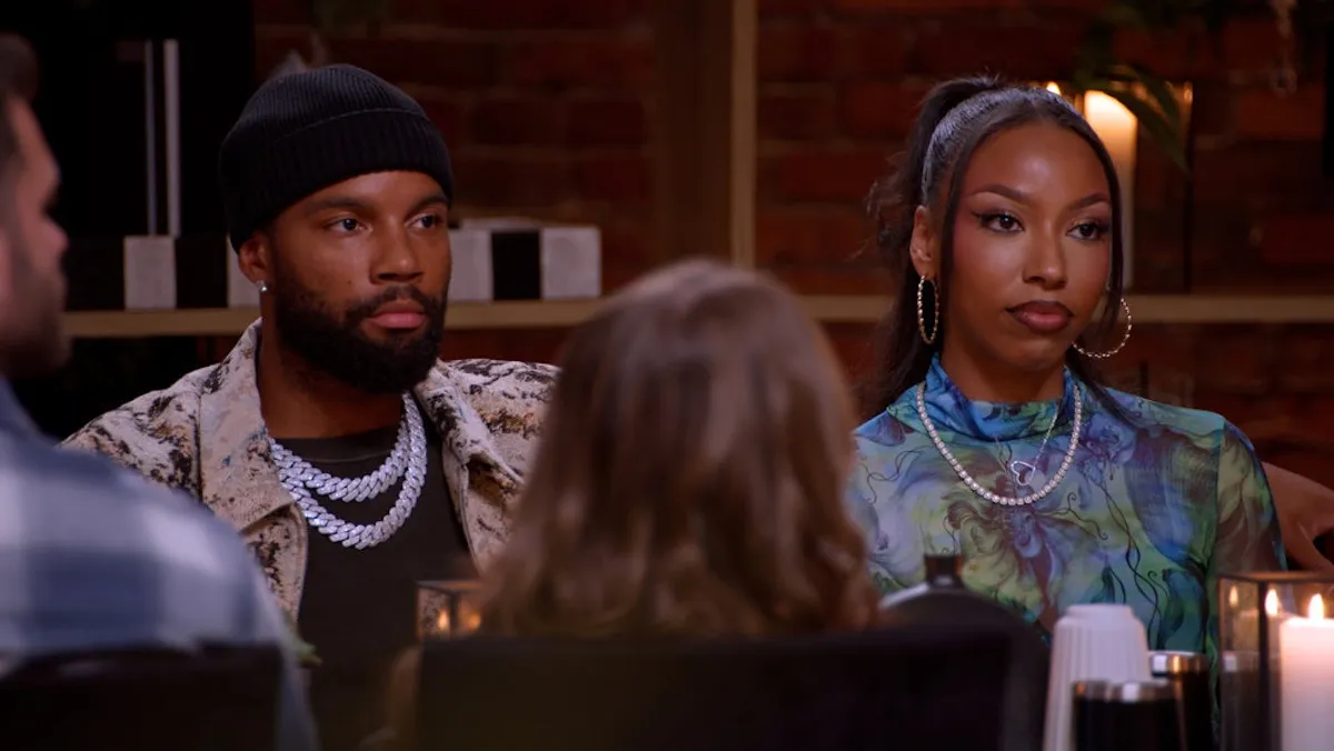 Mecca and BelleJolie sitting next to each other and looking serious in 'Married at First Sight' Season 20
