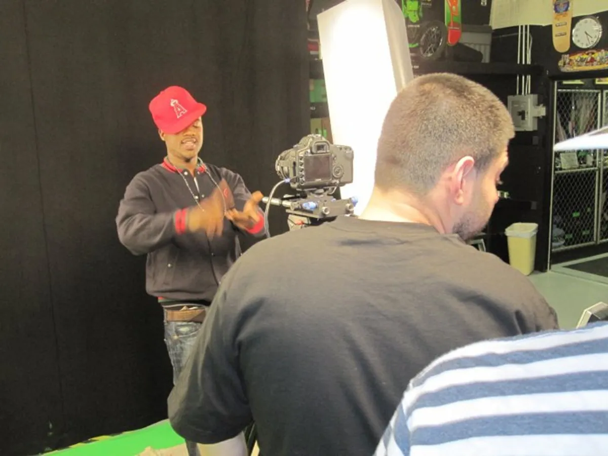Ray J in front of a green screen