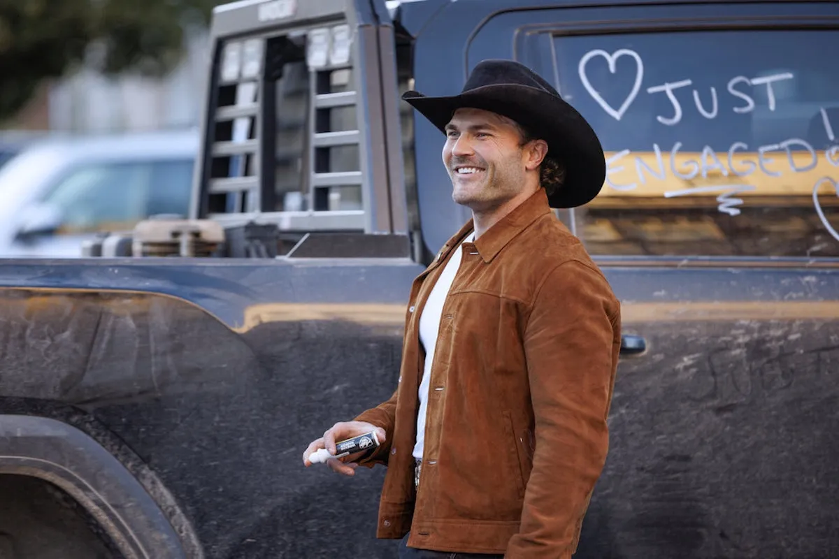 Steven McBee Jr from 'The McBee Dynasty' standing by a truck