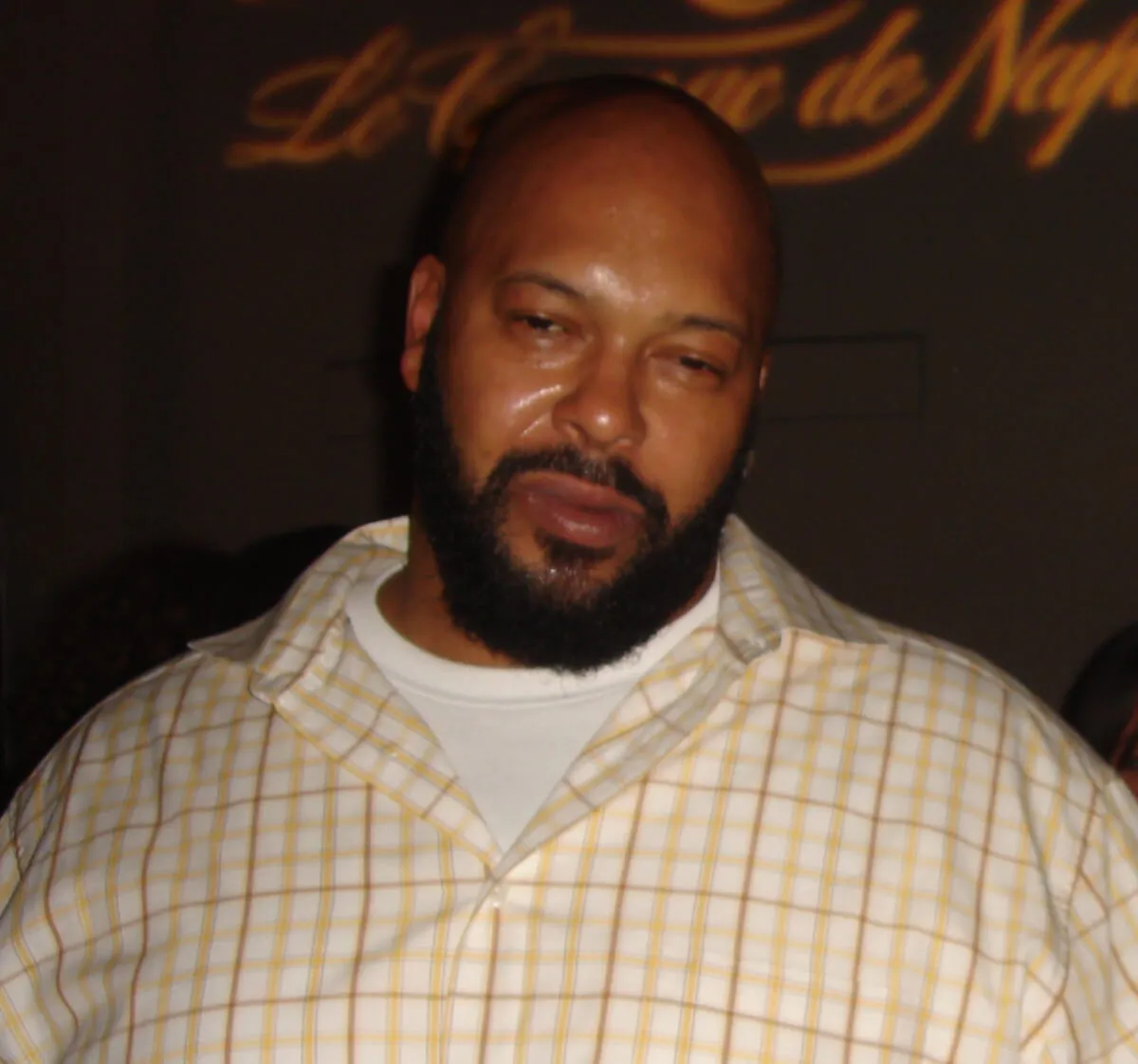 Suge Knight wears a plaid shirt.