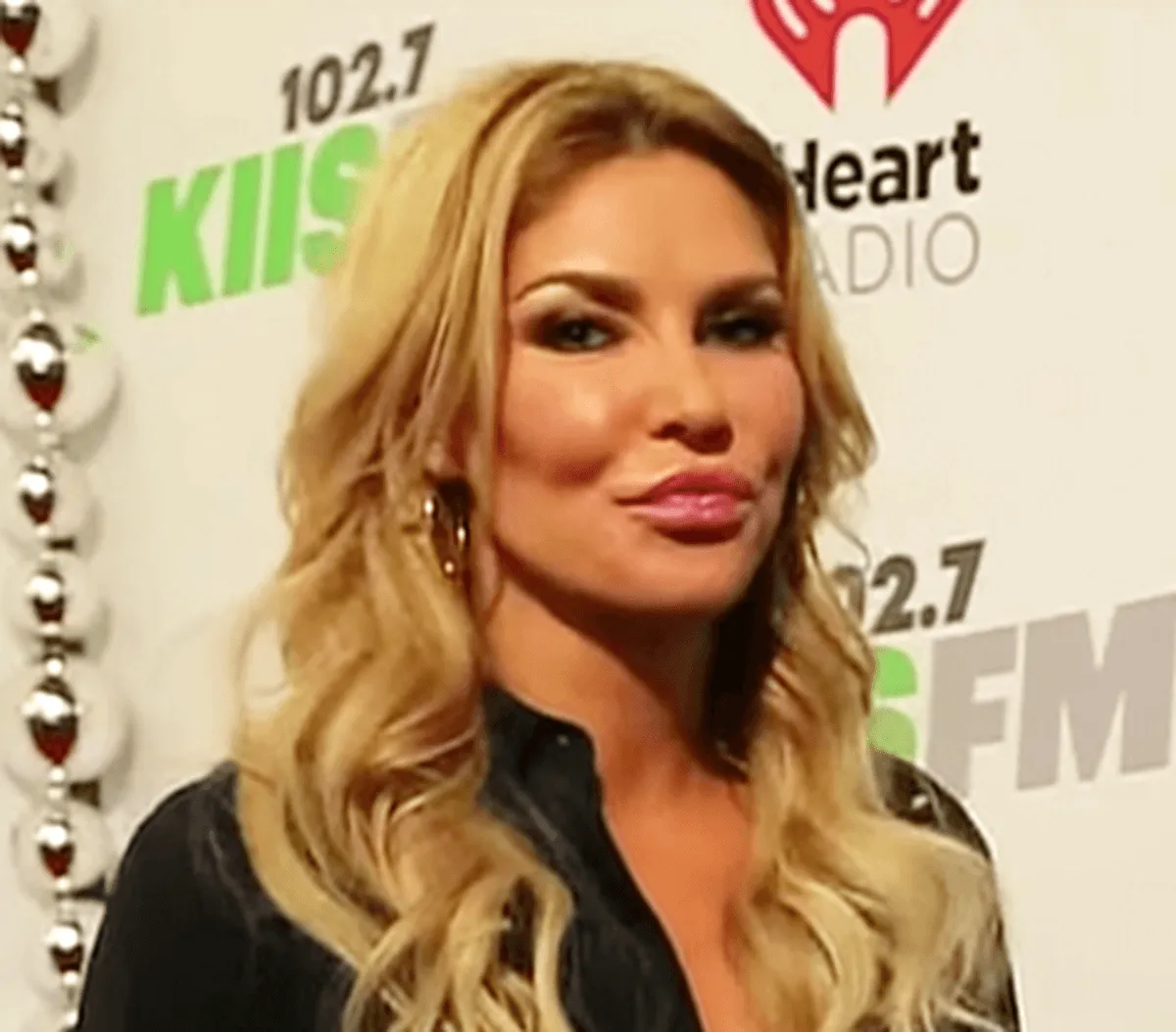 Brandi Glanville wears a black shirt.
