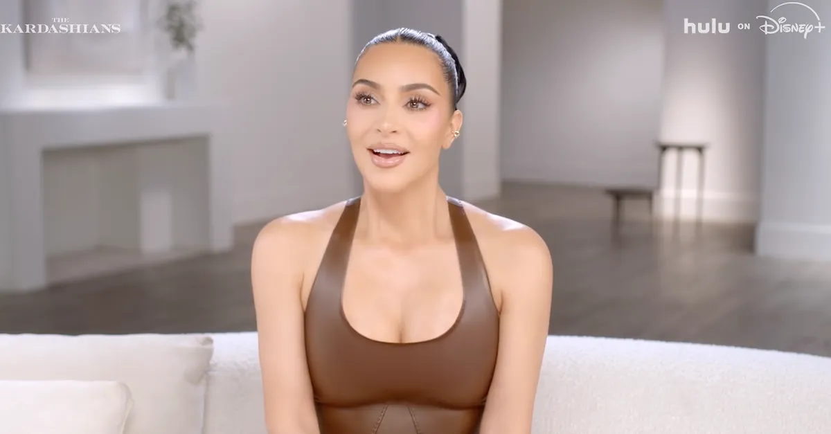 Kim Kardashian wearing a brown tank top in 'The Kardashians' interview segment