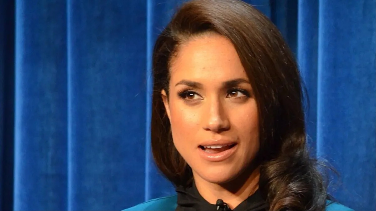 Meghan Markle faces brutal backlash. (Image Credit: Genevieve, CC BY 2.0, via Wikimedia Commons)