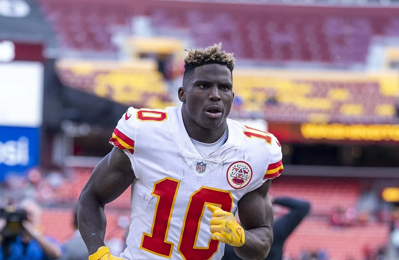 Tyreek HIll running onto the field